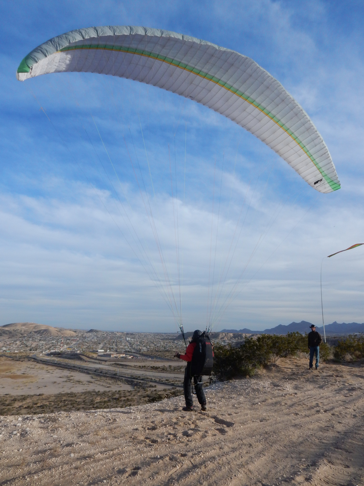 launching a paraglider at Anapra Mesa